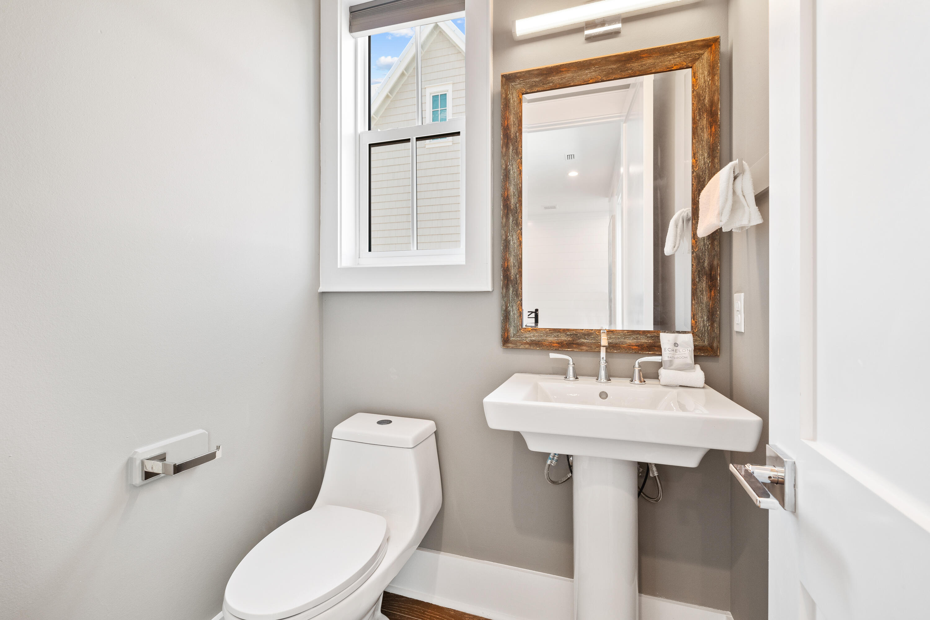 196 South Wall Street Inlet Beach, FL 32461 - Photo 36 of 85 a bathroom with a sink mirror and toilet