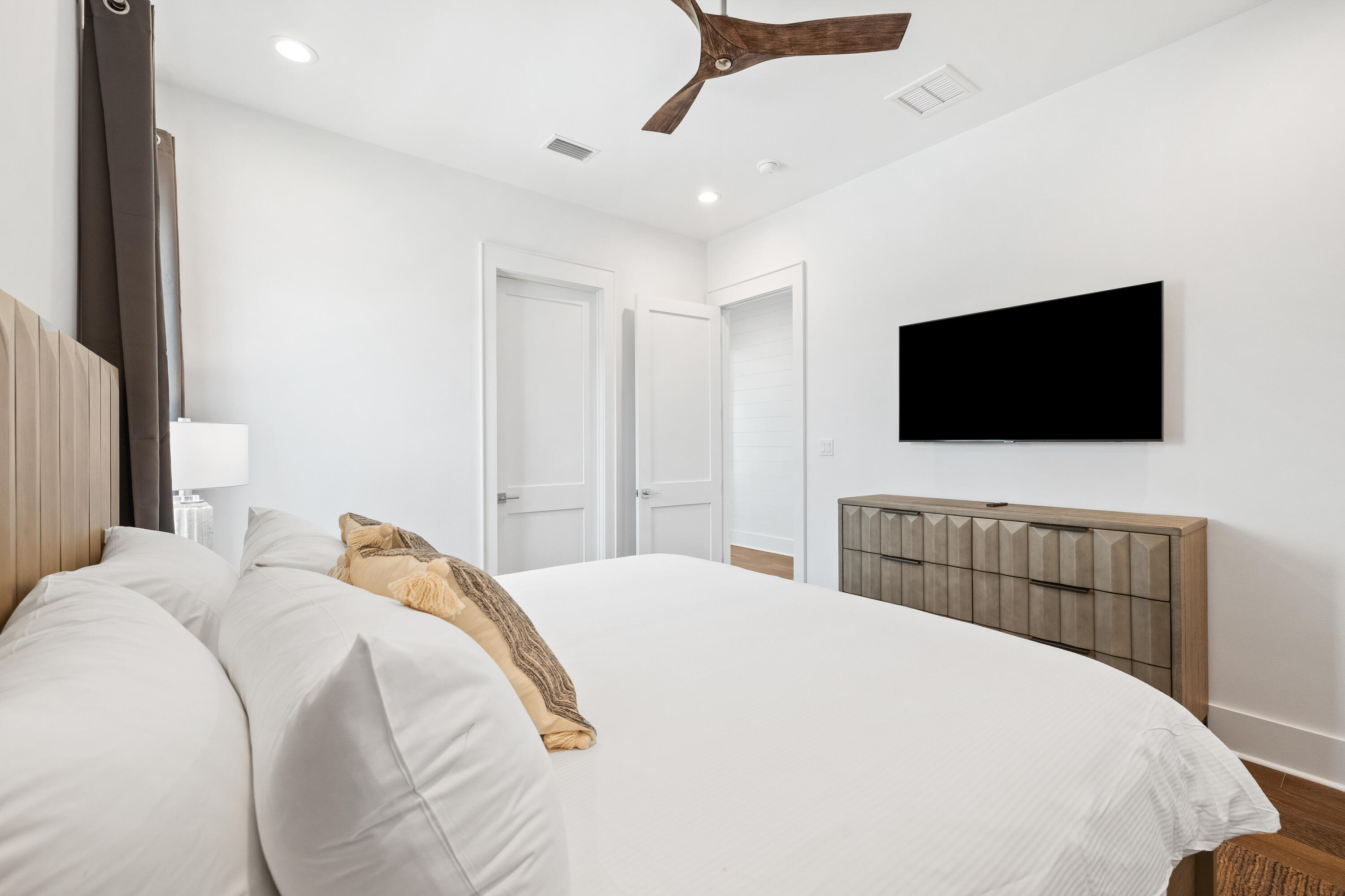 196 South Wall Street Inlet Beach, FL 32461 - Photo 38 of 85 a bedroom with a bed and a flat screen tv