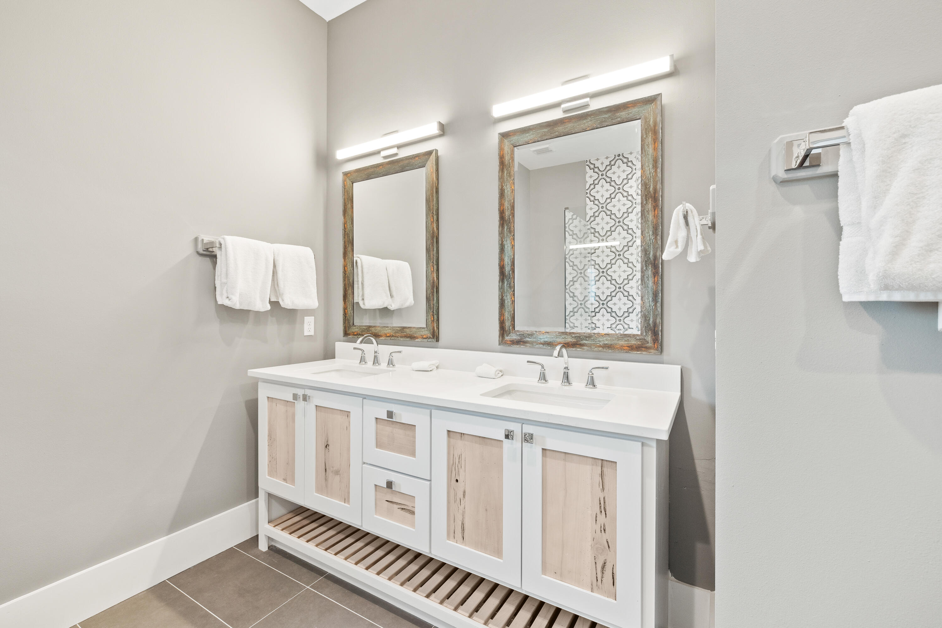 196 South Wall Street Inlet Beach, FL 32461 - Photo 48 of 85 a bathroom with double vanity sink and mirror