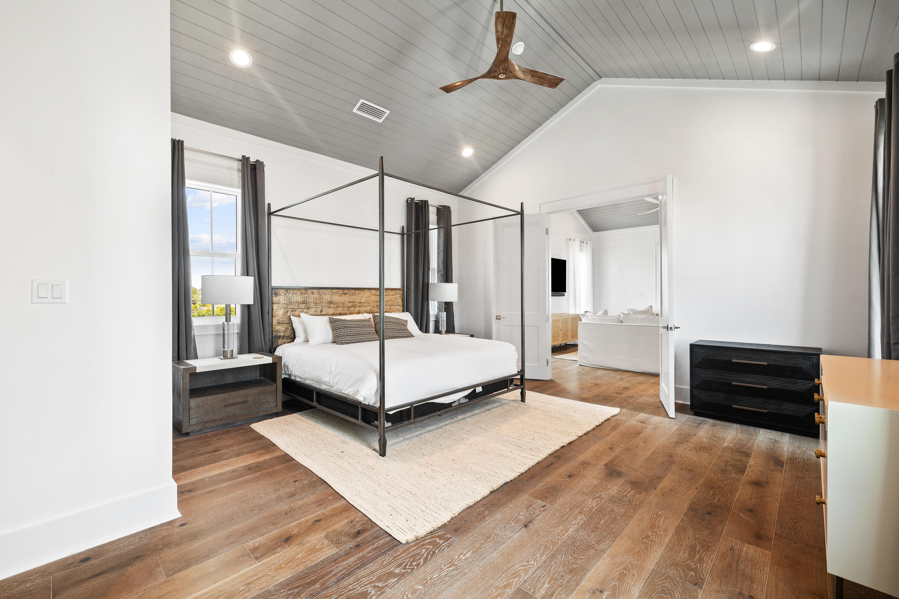 196 South Wall Street Inlet Beach, FL 32461 - Photo 66 of 85 a spacious bedroom with a bed and wooden floor