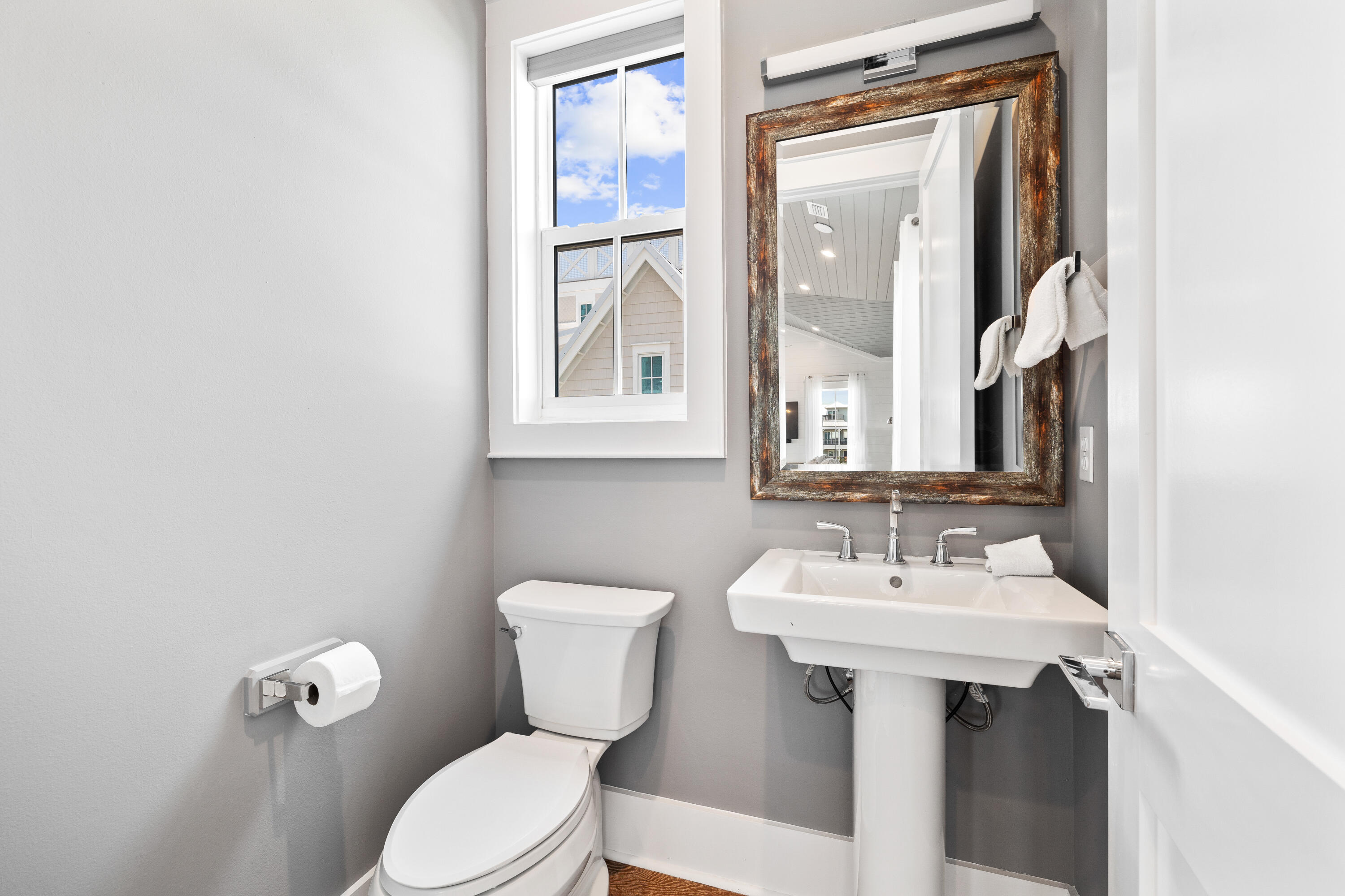 196 South Wall Street Inlet Beach, FL 32461 - Photo 73 of 85 a bathroom with a toilet sink and mirror
