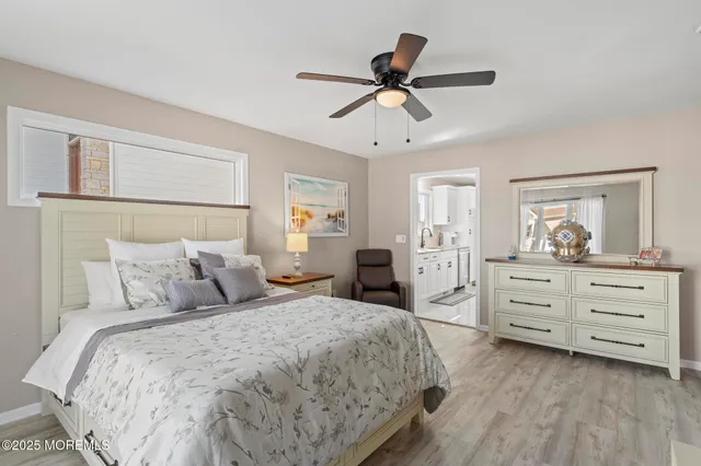 a living room with fireplace furniture and a large window