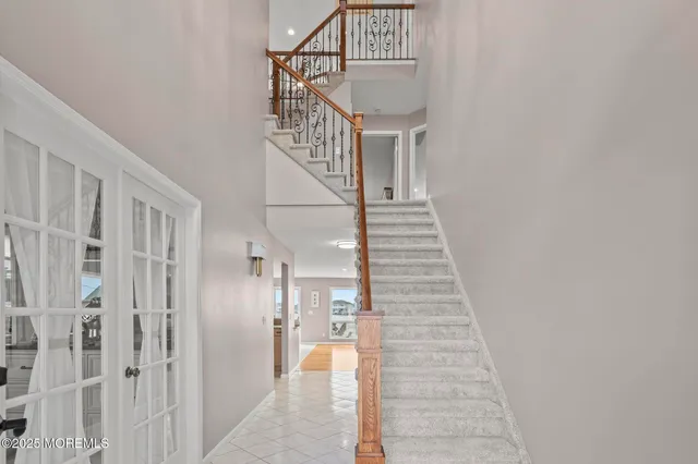a living room with furniture and a view of kitchen