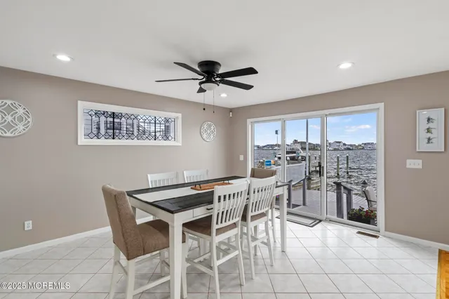 a spacious bedroom with a bed and a flat screen tv