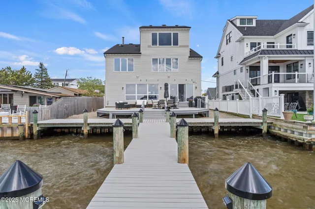 a view of a lake with lawn chairs
