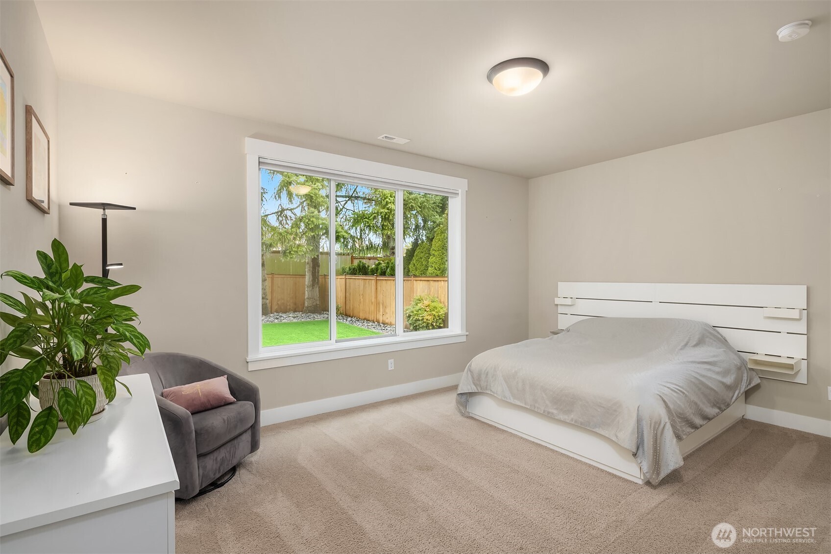 1435 242nd Place Southeast Bothell, WA 98021 - Photo 22 of 40 a bedroom with a bed and a couch