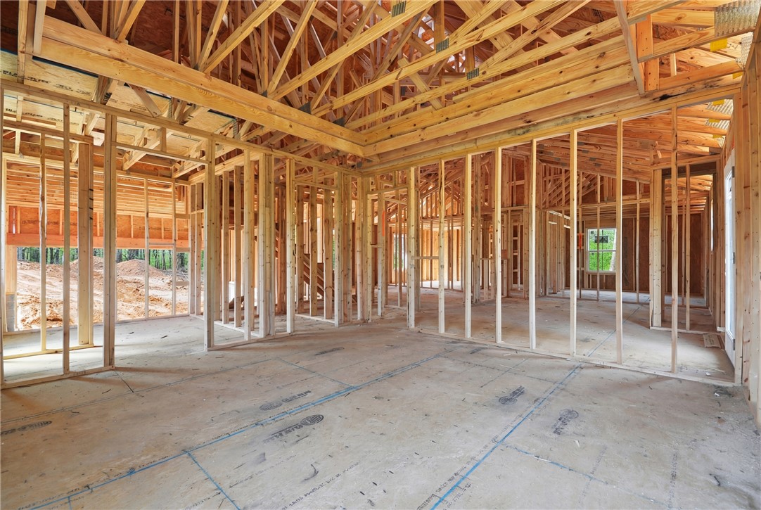 104 Albert Drive Honea Path, SC 29654 - Photo 9 of 32 This interior view captures the framework of a new home, showcasing its potential.