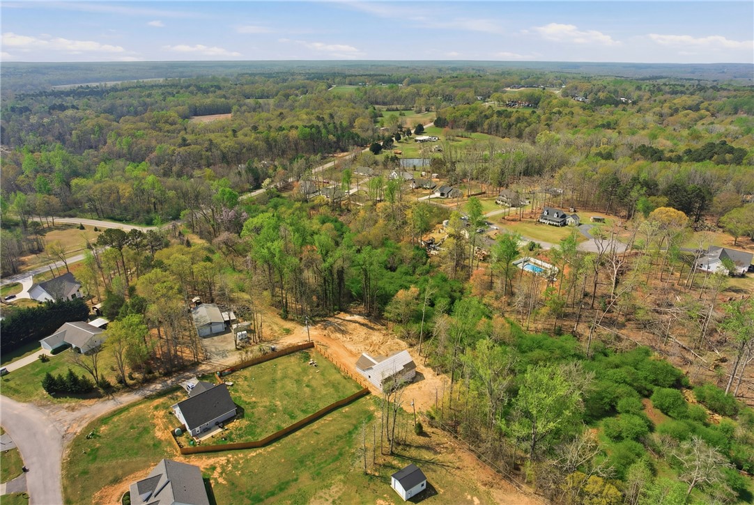 104 Albert Drive Honea Path, SC 29654 - Photo 26 of 32 View this expansive lot with mature trees and a tranquil setting, offering endless possibilities.