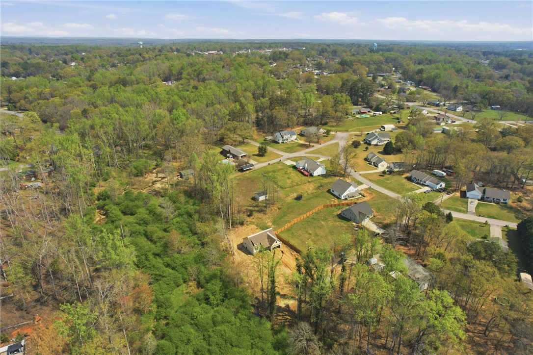 104 Albert Drive Honea Path, SC 29654 - Photo 28 of 32 Expansive aerial views reveal a thriving community nestled amidst abundant greenery.