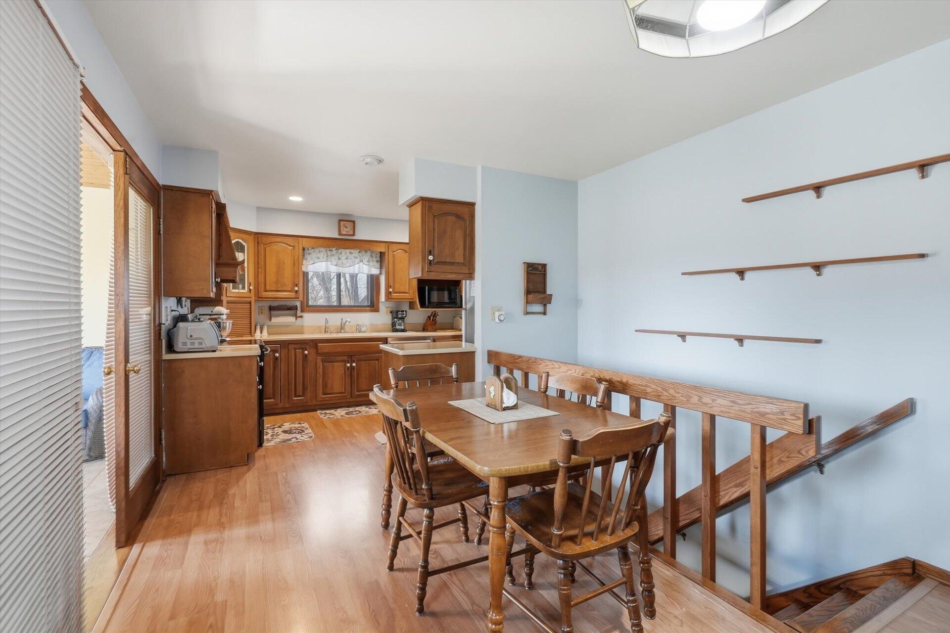 N9376 East Shore Road Mukwonago, WI 53149 - Photo 16 of 30 Dinette and Kitchen open to sunroom