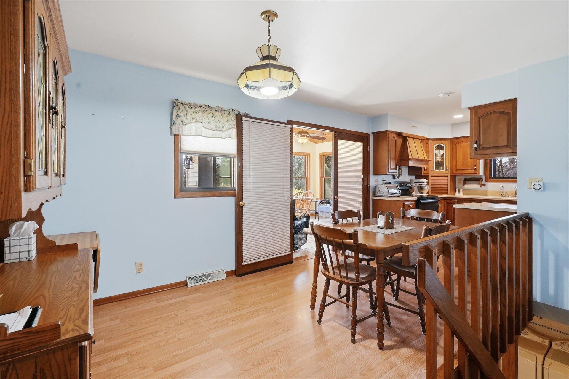 N9376 East Shore Road Mukwonago, WI 53149 - Photo 17 of 30 Dinette open to sunroom and kitchen