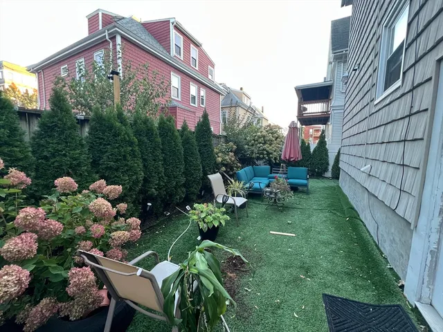 a backyard of a house with lots of green space