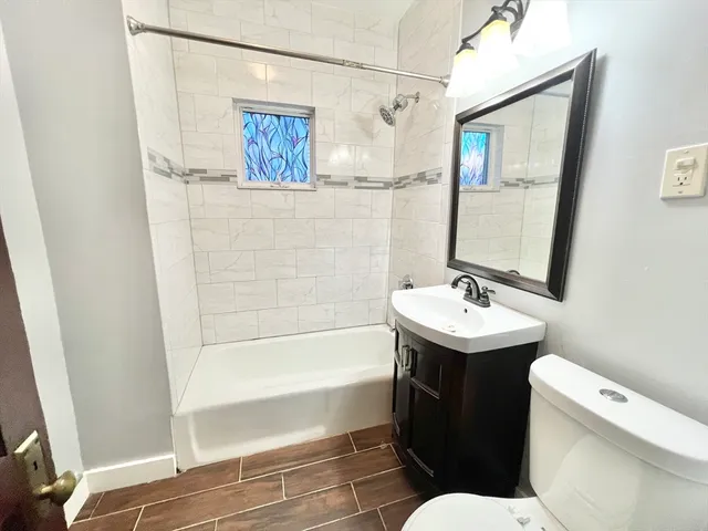 a bathroom with a sink toilet and shower