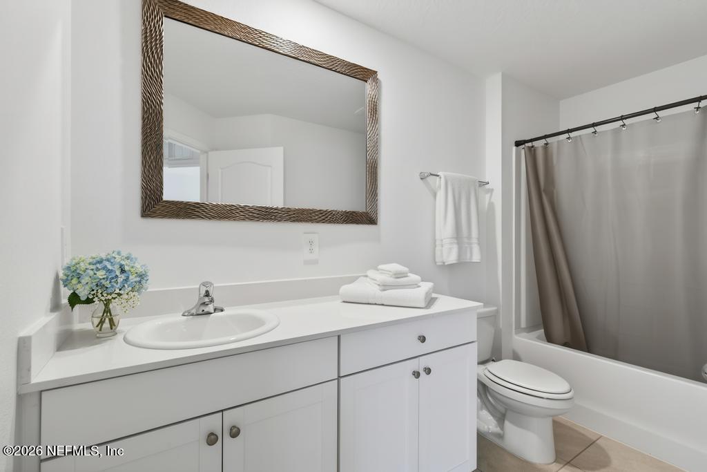 45 Seaport Breeze Road St. Augustine, FL 32095 - Photo 56 of 88 a bathroom with a sink toilet and mirror
