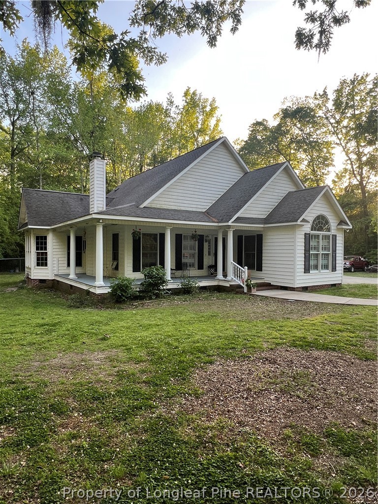 169 Bradshaw Road Bladenboro, NC 28320 - Photo 1 of 34 a front view of a house with a garden