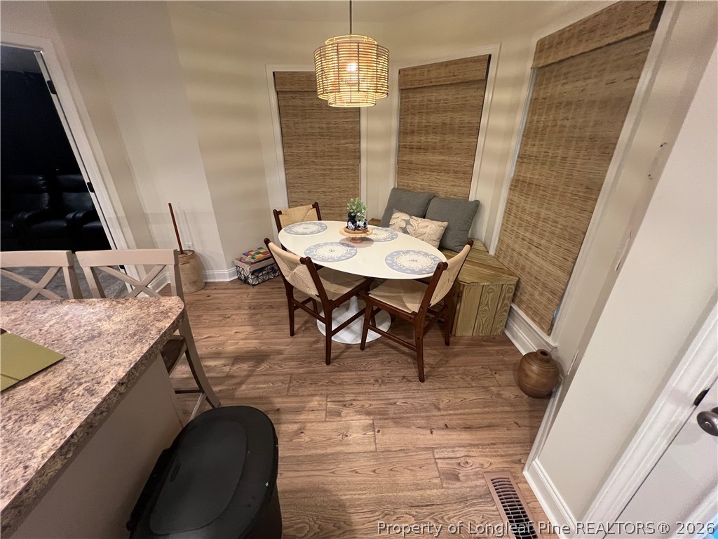 169 Bradshaw Road Bladenboro, NC 28320 - Photo 13 of 34 a view of a dining room with furniture and wooden floor