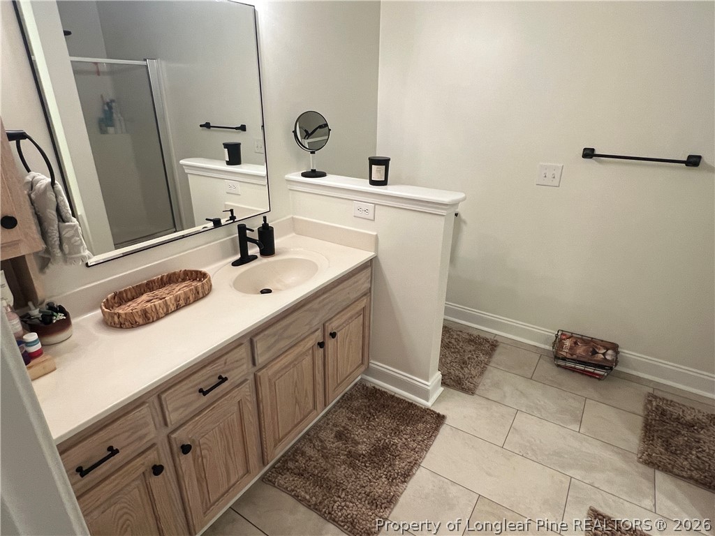 169 Bradshaw Road Bladenboro, NC 28320 - Photo 19 of 34 a bathroom with a sink and a mirror
