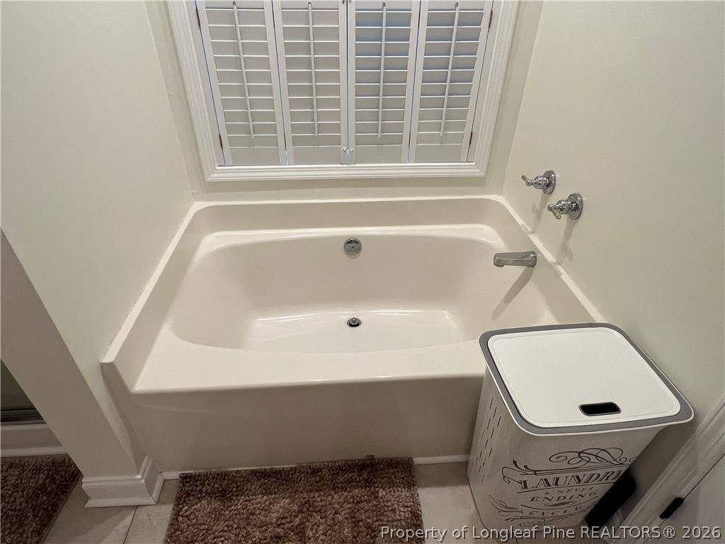 169 Bradshaw Road Bladenboro, NC 28320 - Photo 20 of 34 a bathroom with a sink and a bathtub