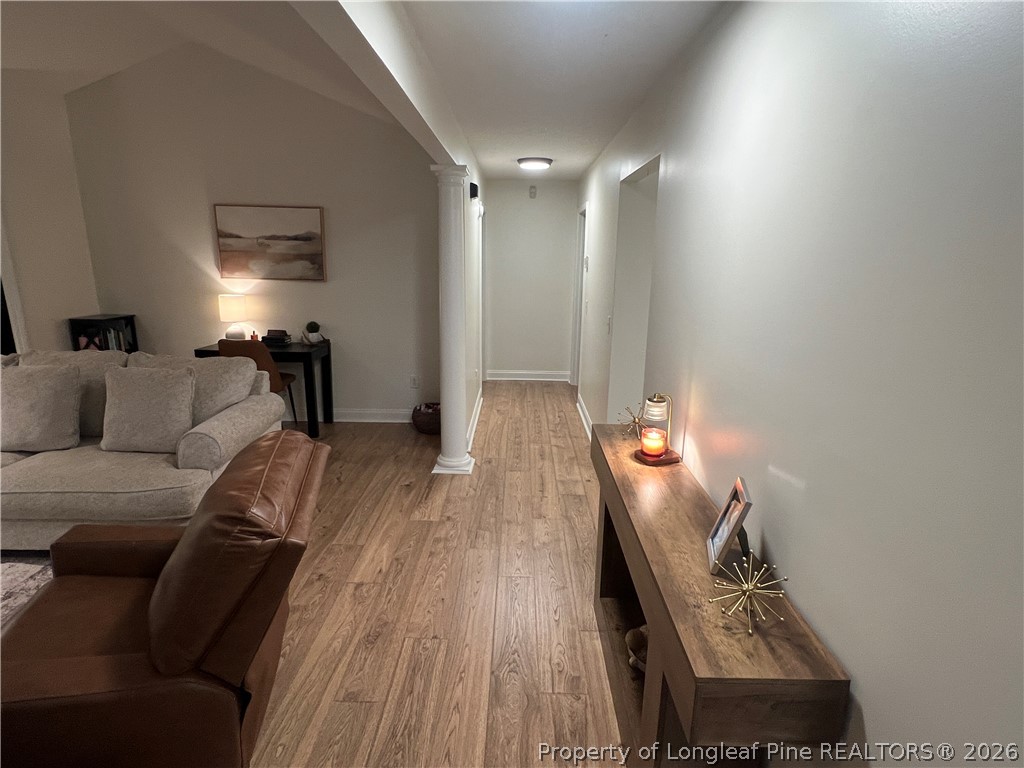 169 Bradshaw Road Bladenboro, NC 28320 - Photo 23 of 34 a living room with furniture and a wooden floor