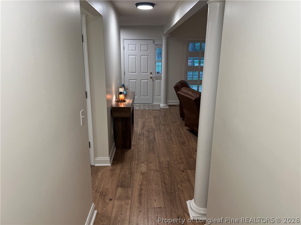 169 Bradshaw Road Bladenboro, NC 28320 - Photo 24 of 34 a view of a hallway with wooden floor and staircase