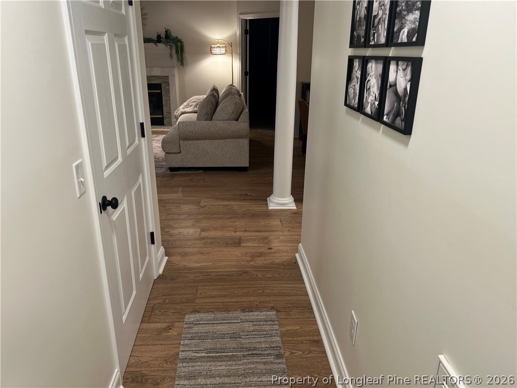 169 Bradshaw Road Bladenboro, NC 28320 - Photo 25 of 34 a hallway with wooden floor and stairs