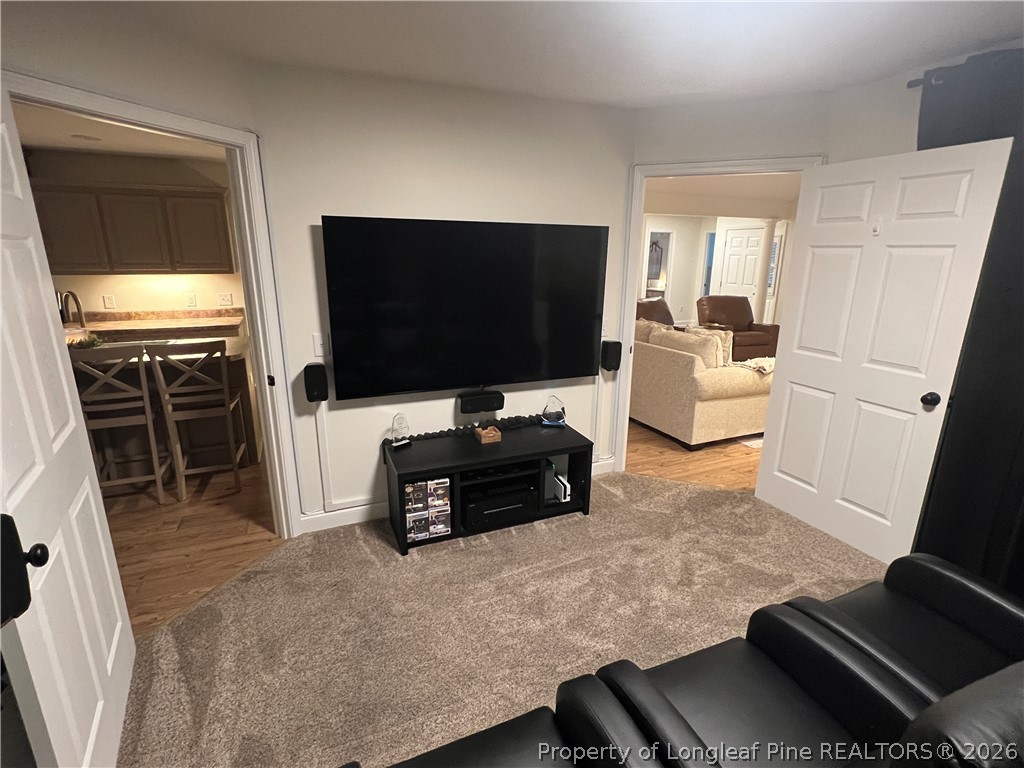 169 Bradshaw Road Bladenboro, NC 28320 - Photo 7 of 34 a living room with furniture and a flat screen tv