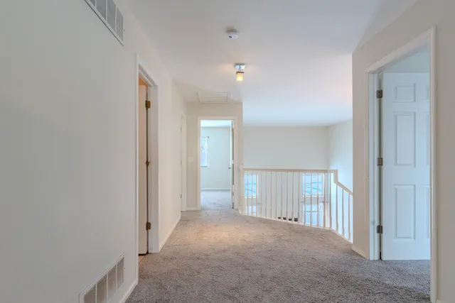 a view of a hallway with closet area