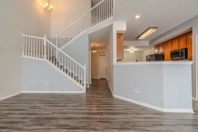 a view of an entryway with wooden floor