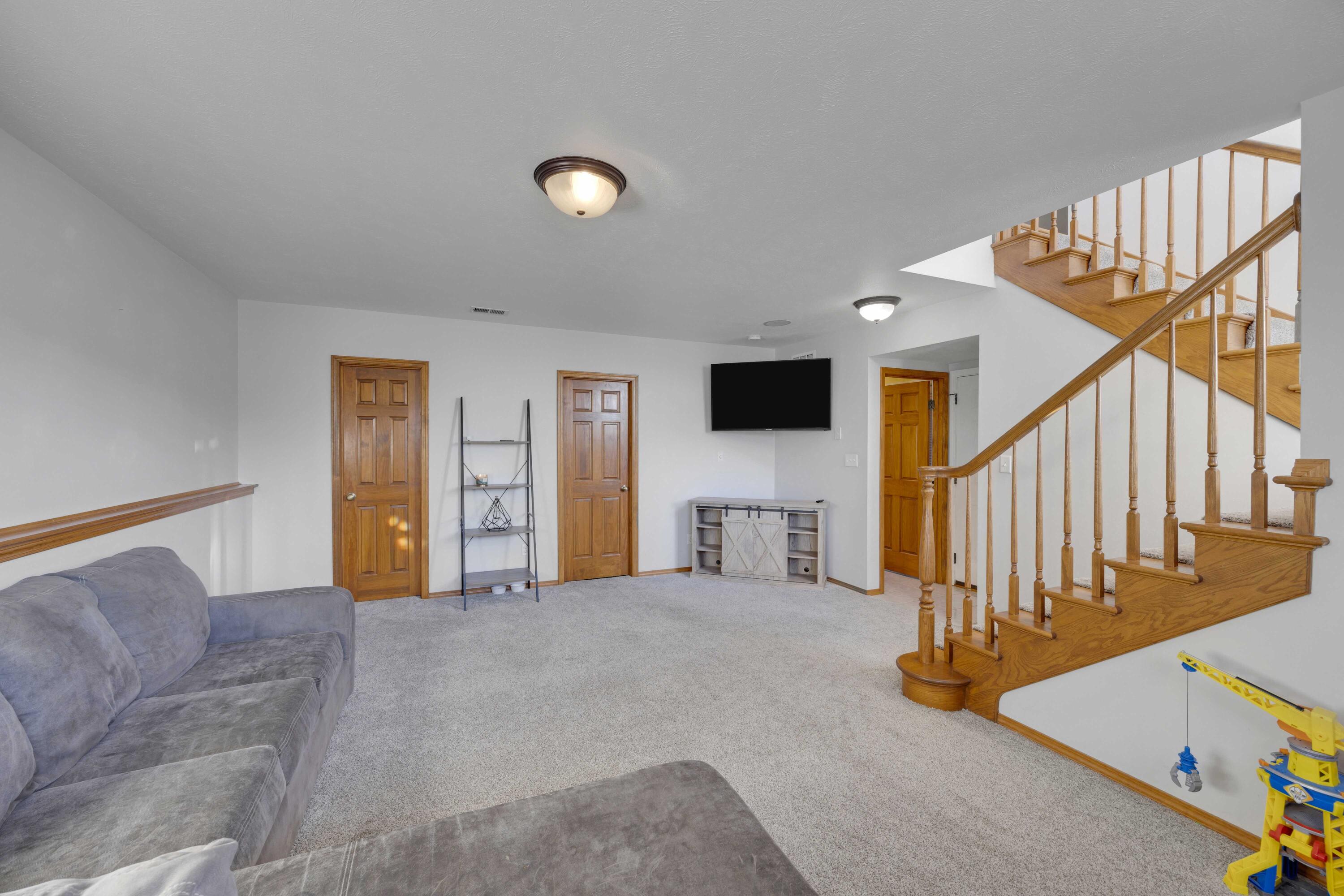 822 Seminole Drive Lowell, IN 46356 - Photo 11 of 28 a view of a livingroom with furniture and stairs