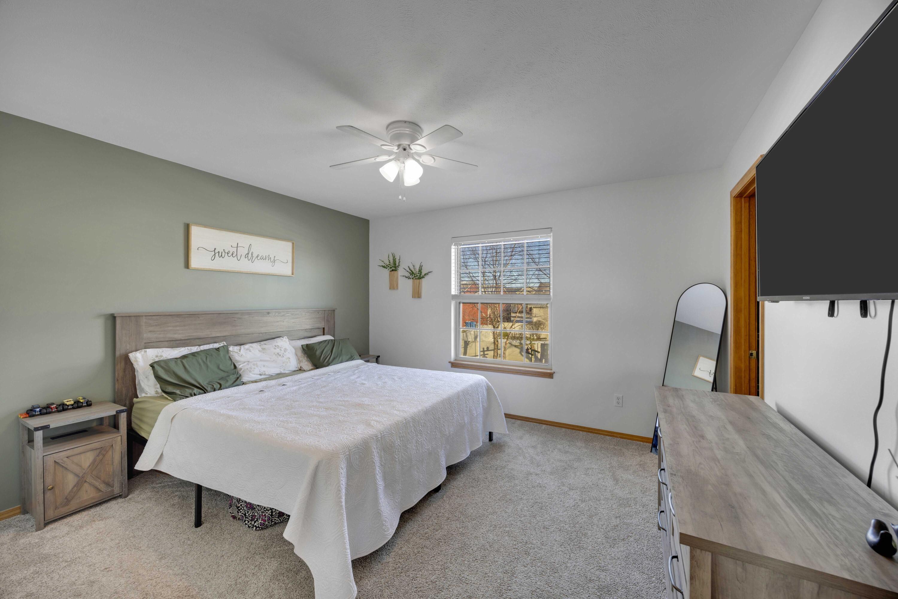 822 Seminole Drive Lowell, IN 46356 - Photo 17 of 28 a bedroom with a bed and a flat screen tv