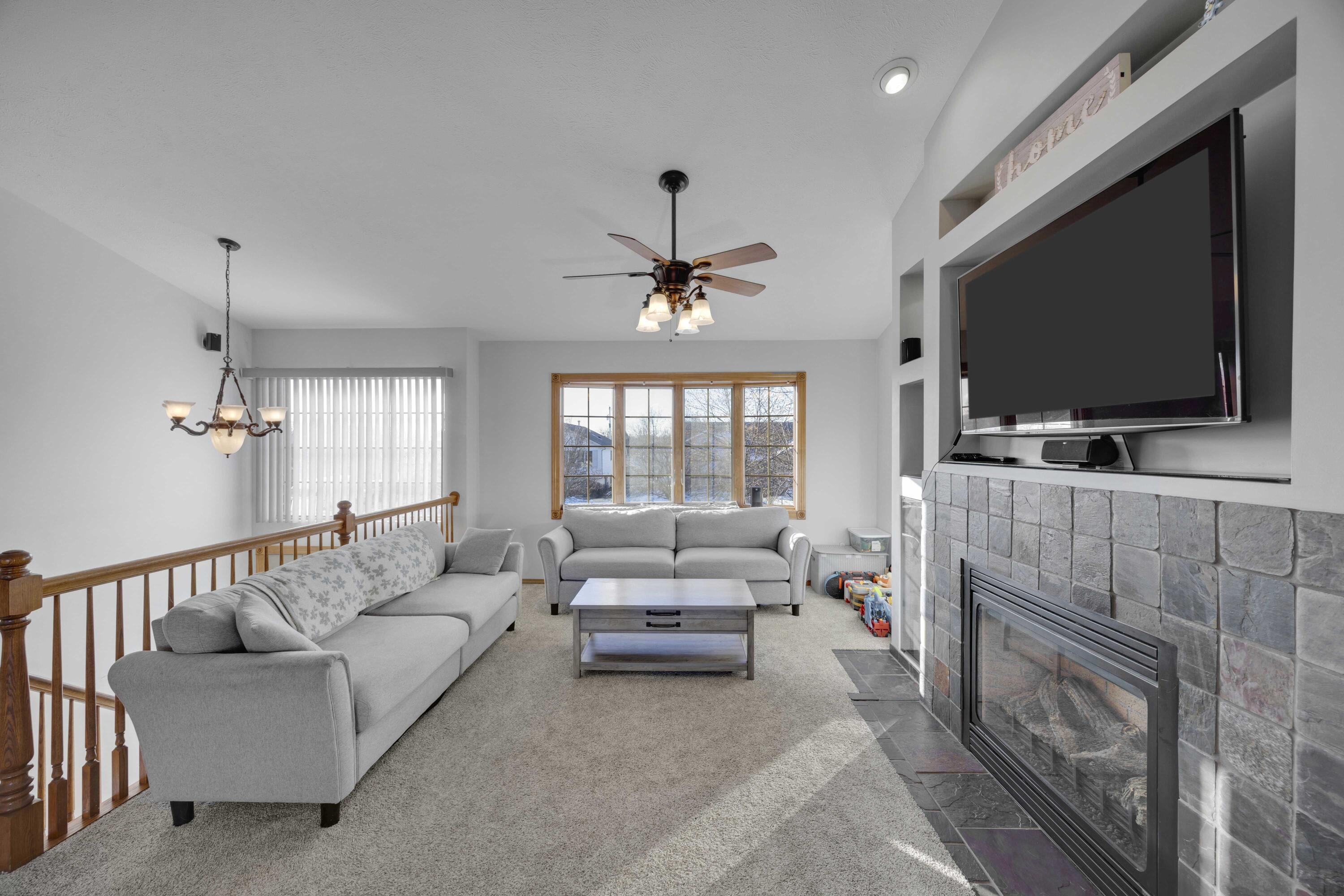 822 Seminole Drive Lowell, IN 46356 - Photo 22 of 28 a living room with furniture and a flat screen tv