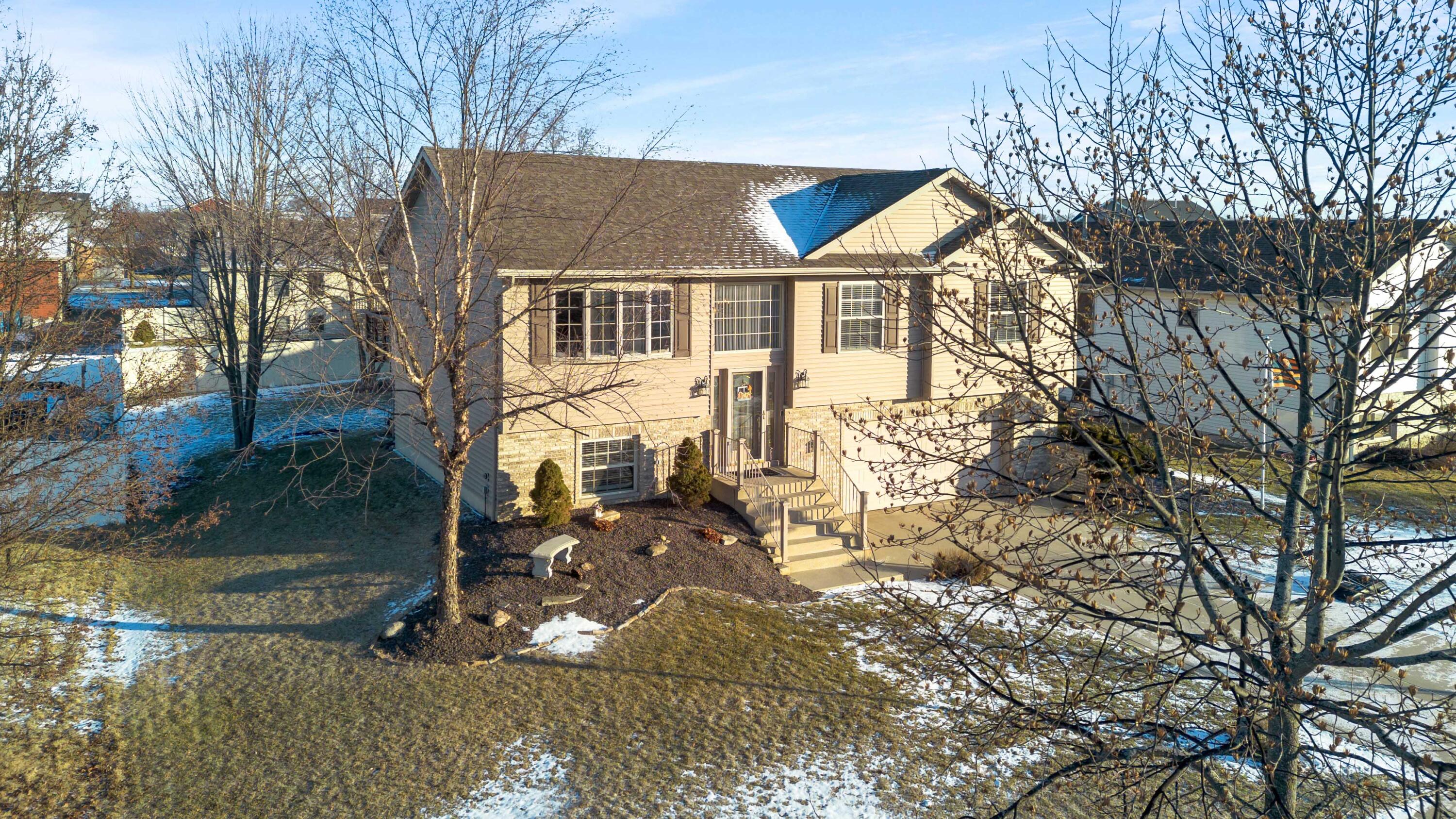 822 Seminole Drive Lowell, IN 46356 - Photo 6 of 28 a front view of a house with a yard