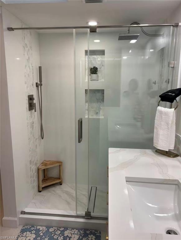 14993 Rivers Edge Court, Unit 246 Fort Myers, FL 33908 - Photo 7 of 23 a bathroom with a shower