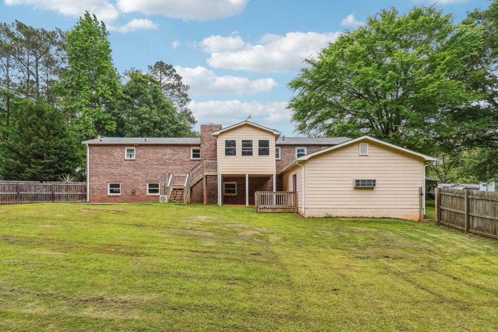 667 Stagecoach Road Stockbridge, GA 30281 - Photo 1 of 1 a view of a house with a yard