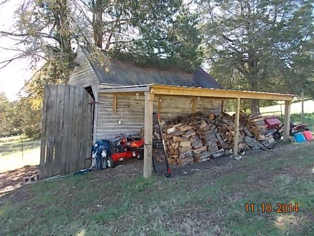 548 Rome Road Riddleton, TN 37151 - Photo 14 of 20 a view of a bike garage next to a yard