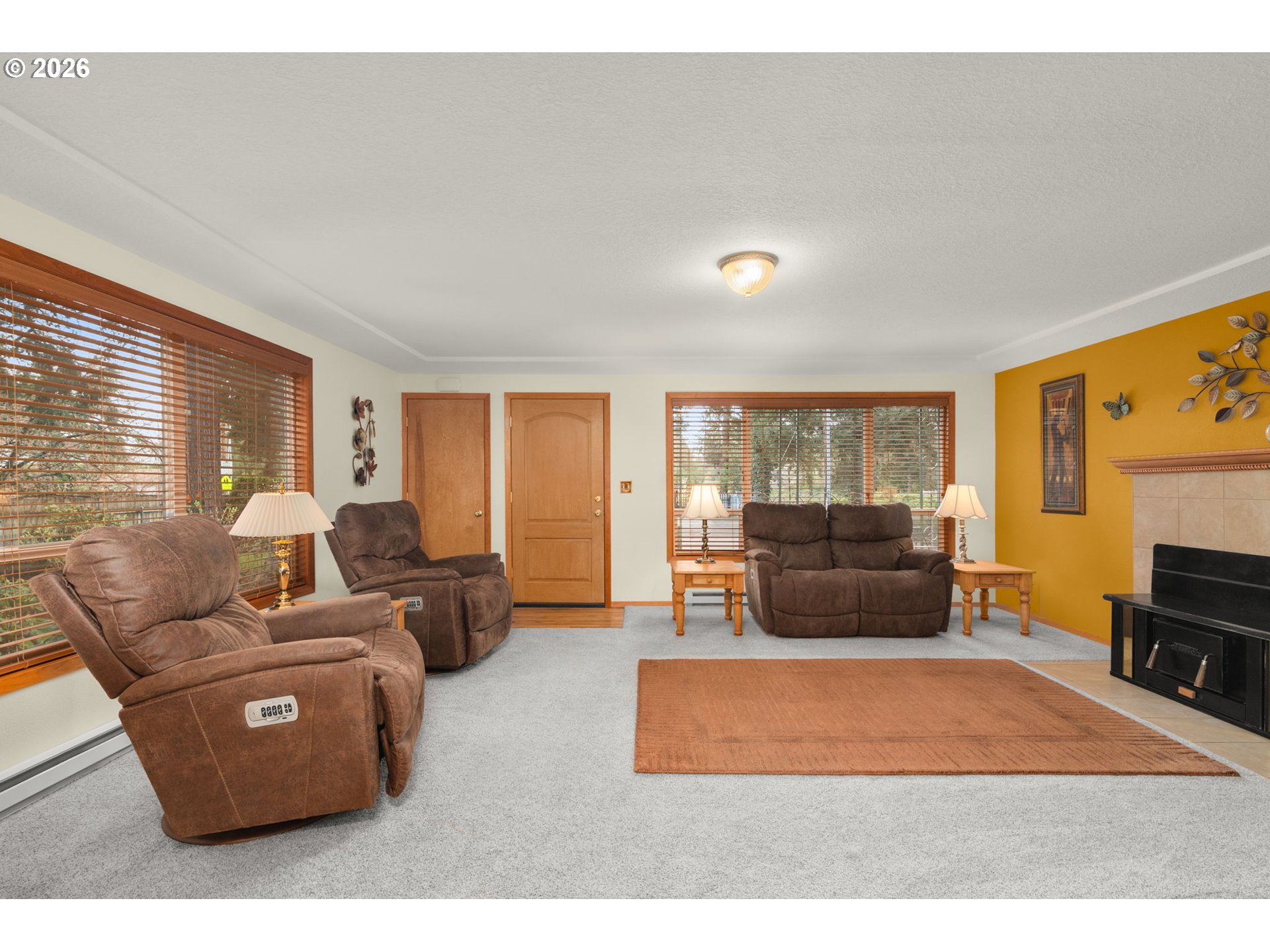 12605 Southeast Holgate Boulevard Portland, OR 97236 - Photo 12 of 43 a living room with furniture window and a flat screen tv