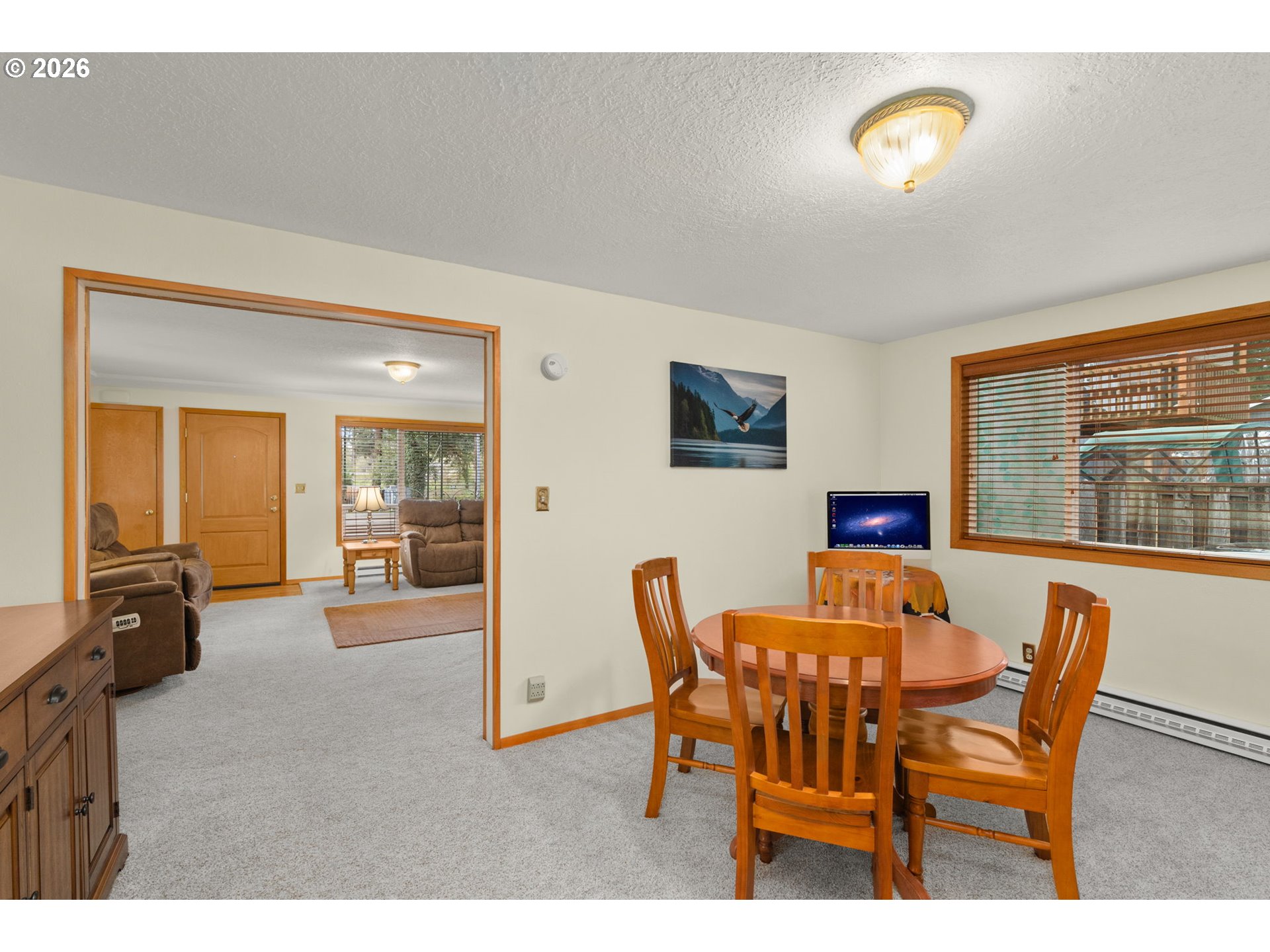 12605 Southeast Holgate Boulevard Portland, OR 97236 - Photo 16 of 43 a dining room with furniture and a floor to ceiling window