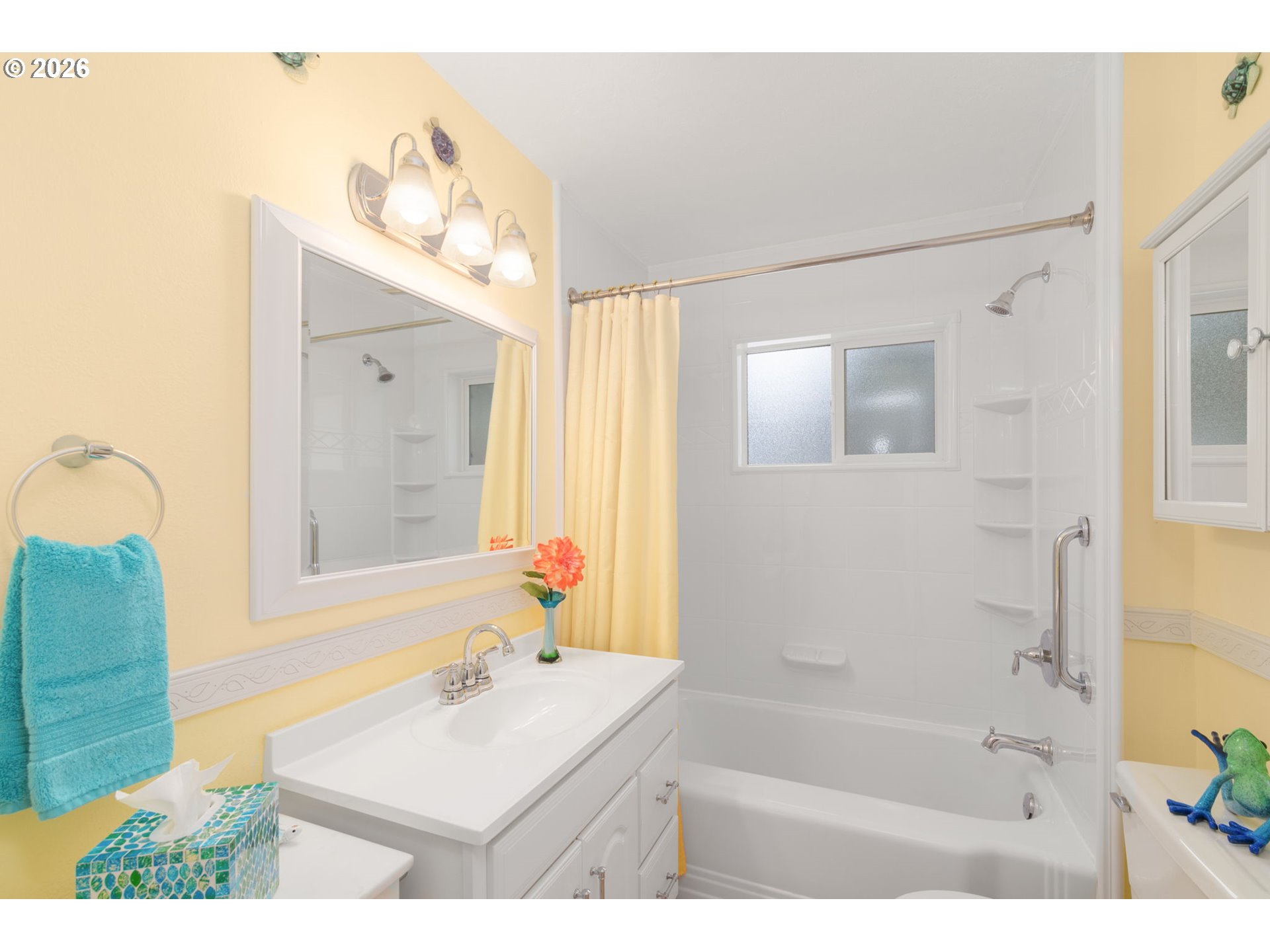12605 Southeast Holgate Boulevard Portland, OR 97236 - Photo 21 of 43 a bathroom with a sink mirror and a bathtub