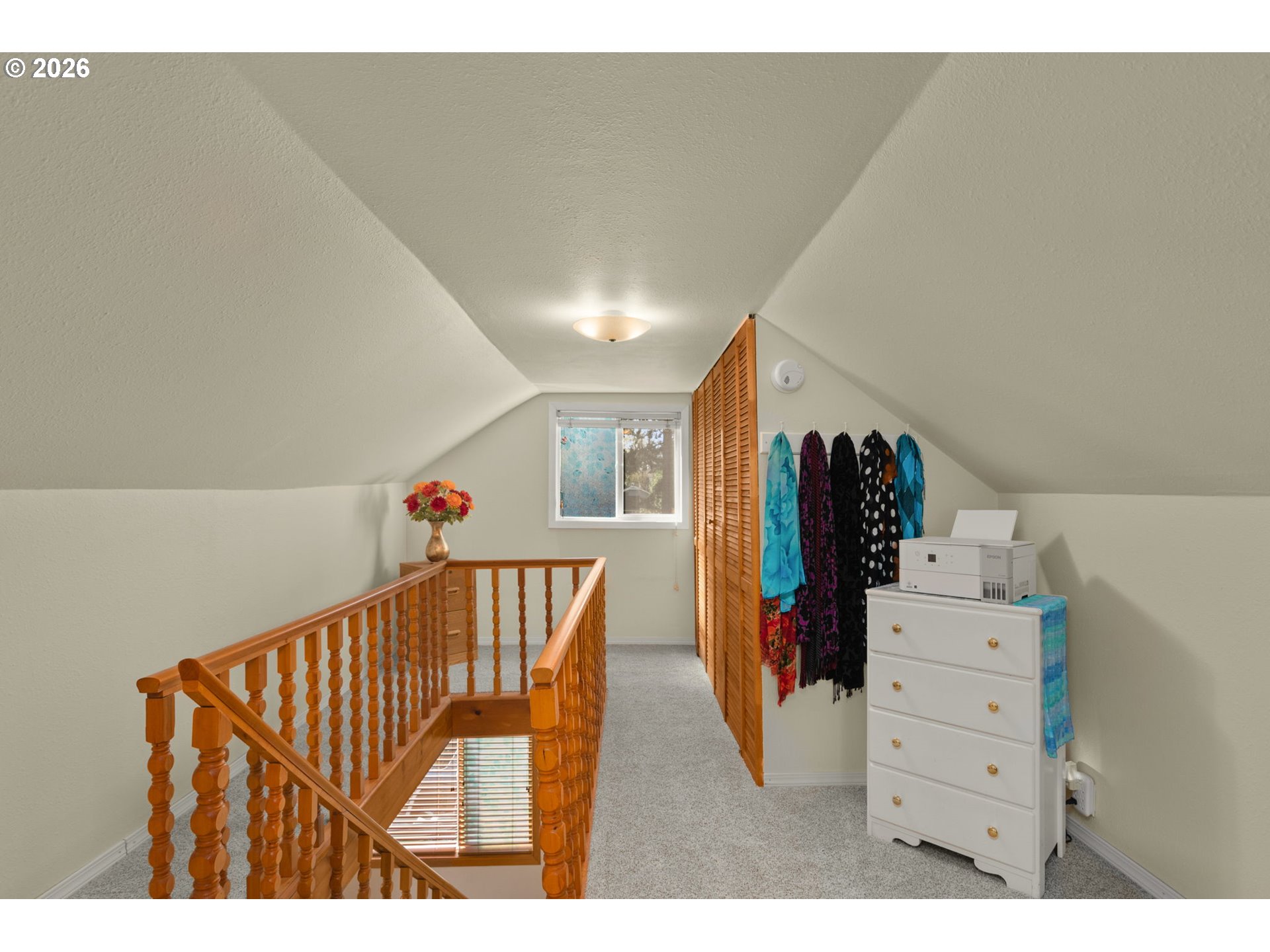 12605 Southeast Holgate Boulevard Portland, OR 97236 - Photo 23 of 43 a view of a hallway with furniture and stairs