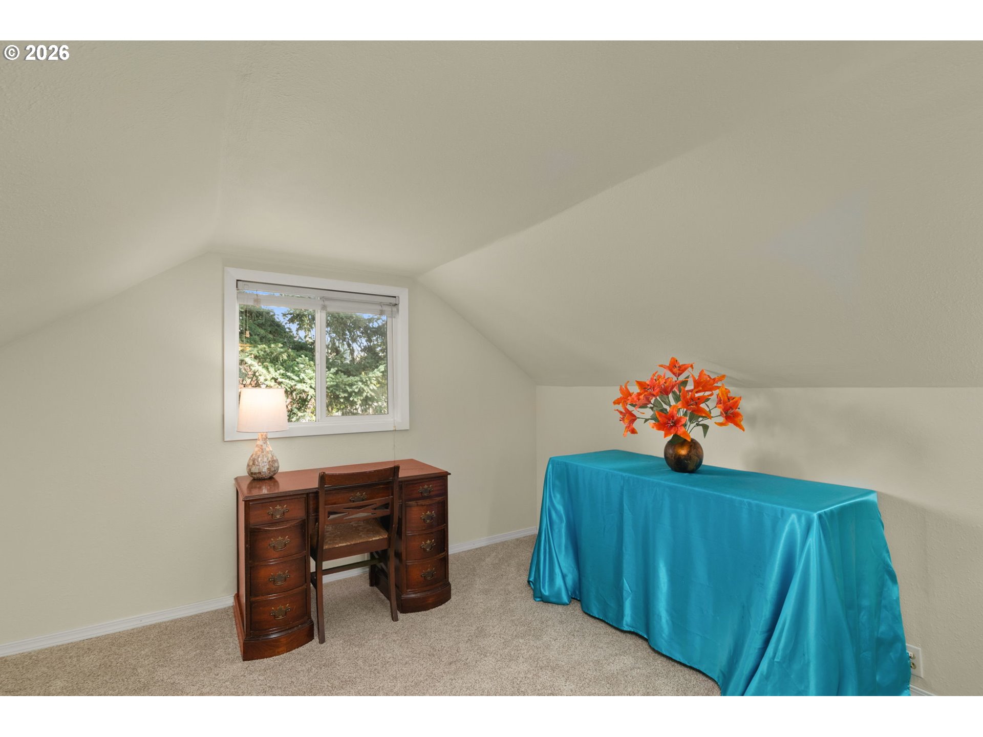 12605 Southeast Holgate Boulevard Portland, OR 97236 - Photo 24 of 43 a hallway with a table and a chair