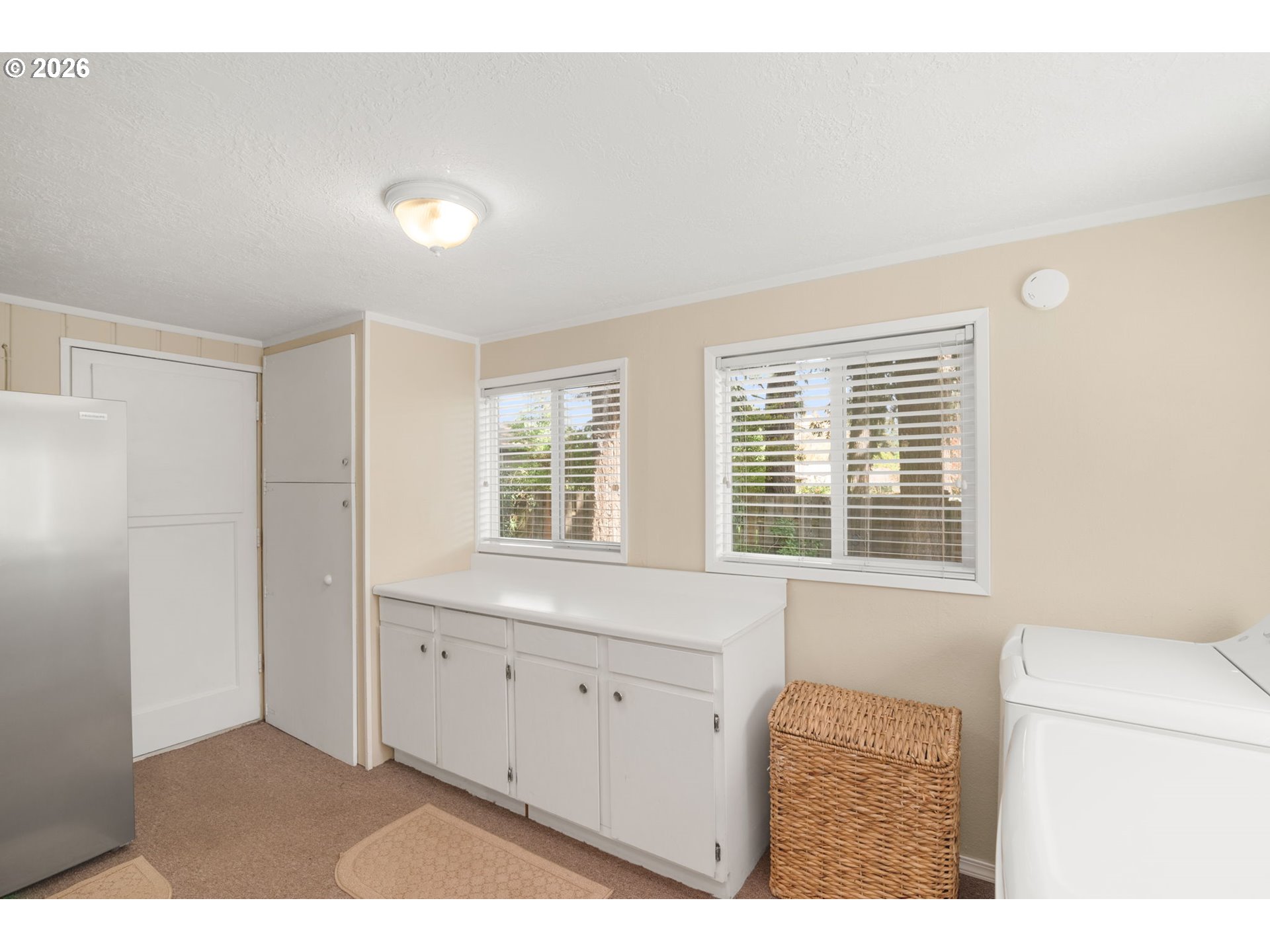 12605 Southeast Holgate Boulevard Portland, OR 97236 - Photo 27 of 43 a view of an empty room with a window
