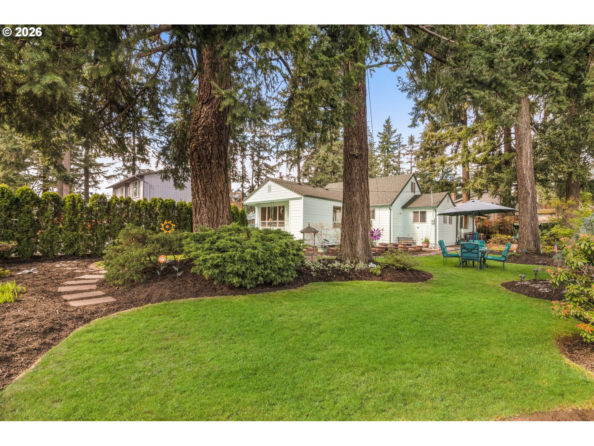 12605 Southeast Holgate Boulevard Portland, OR 97236 - Photo 33 of 43 a front view of a house with a yard