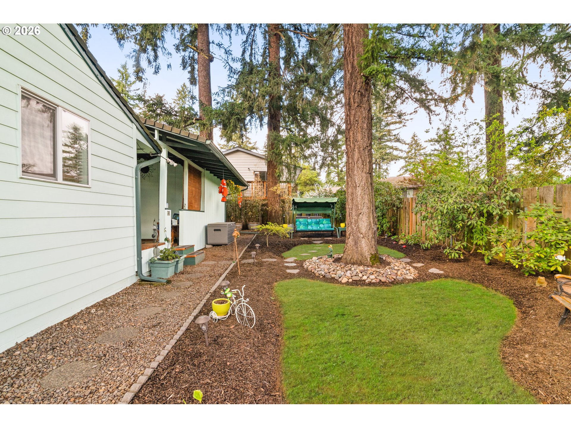 12605 Southeast Holgate Boulevard Portland, OR 97236 - Photo 37 of 43 a view of a house with backyard and sitting area