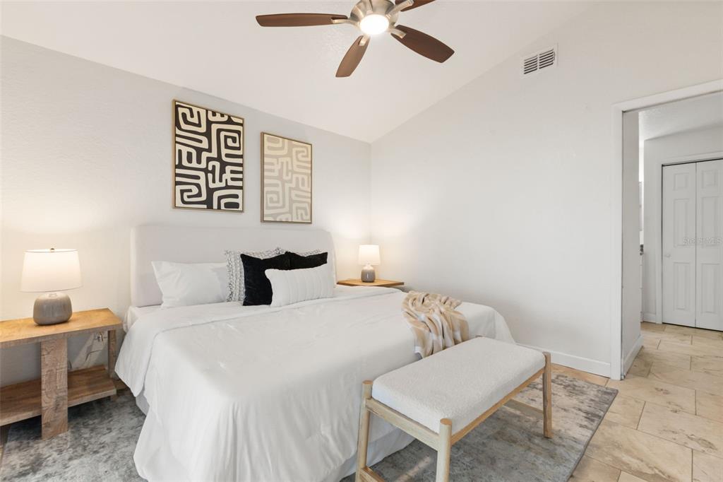2462 Fort Lane Road Geneva, FL 32732 - Photo 13 of 31 a bedroom with a bed and a chandelier