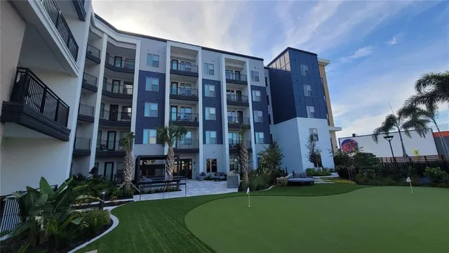 a view of a building with a yard