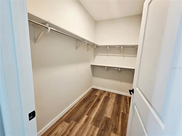 a view of an empty walk in closet