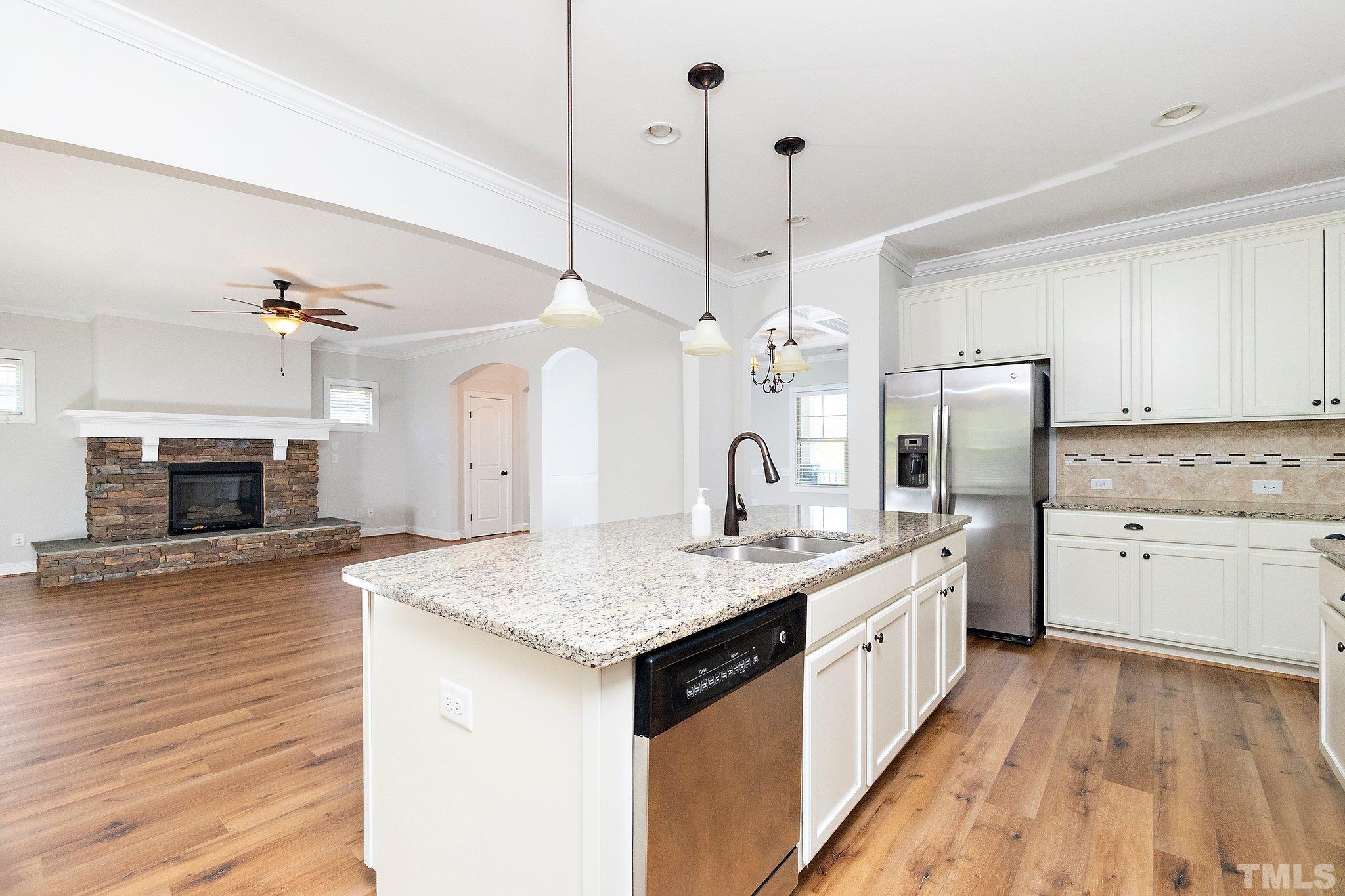 4401 Glengrove Road Raleigh, NC 27616 - Photo 26 of 26 a large kitchen with sink a stove and refrigerator