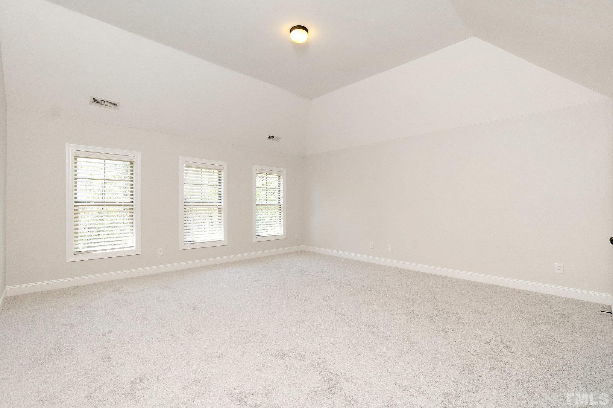 4401 Glengrove Road Raleigh, NC 27616 - Photo 18 of 26 an empty room with windows