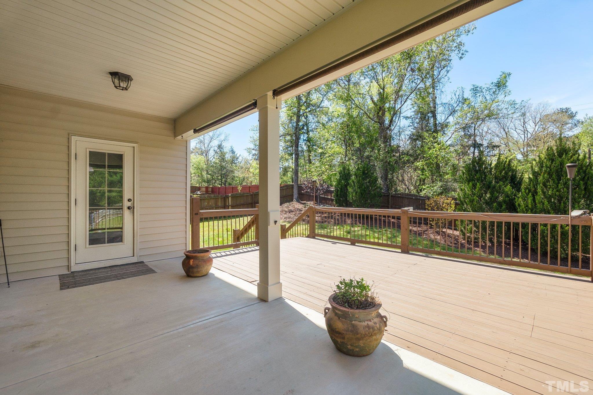 4401 Glengrove Road Raleigh, NC 27616 - Photo 23 of 26 a view of a balcony with lake view and a garden