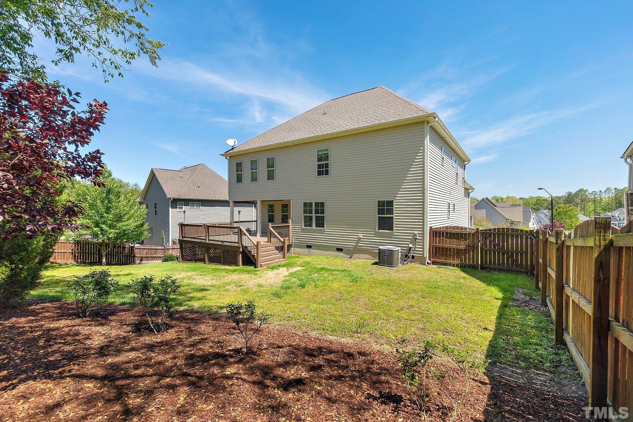 4401 Glengrove Road Raleigh, NC 27616 - Photo 24 of 26 a view of a house with backyard porch and sitting area